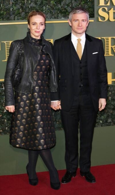 Martin Freeman holds hands with Amanda Abbington