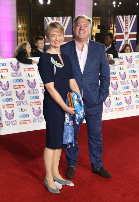 Ed Balls and Yvette Cooper smiling together at a red carpet event